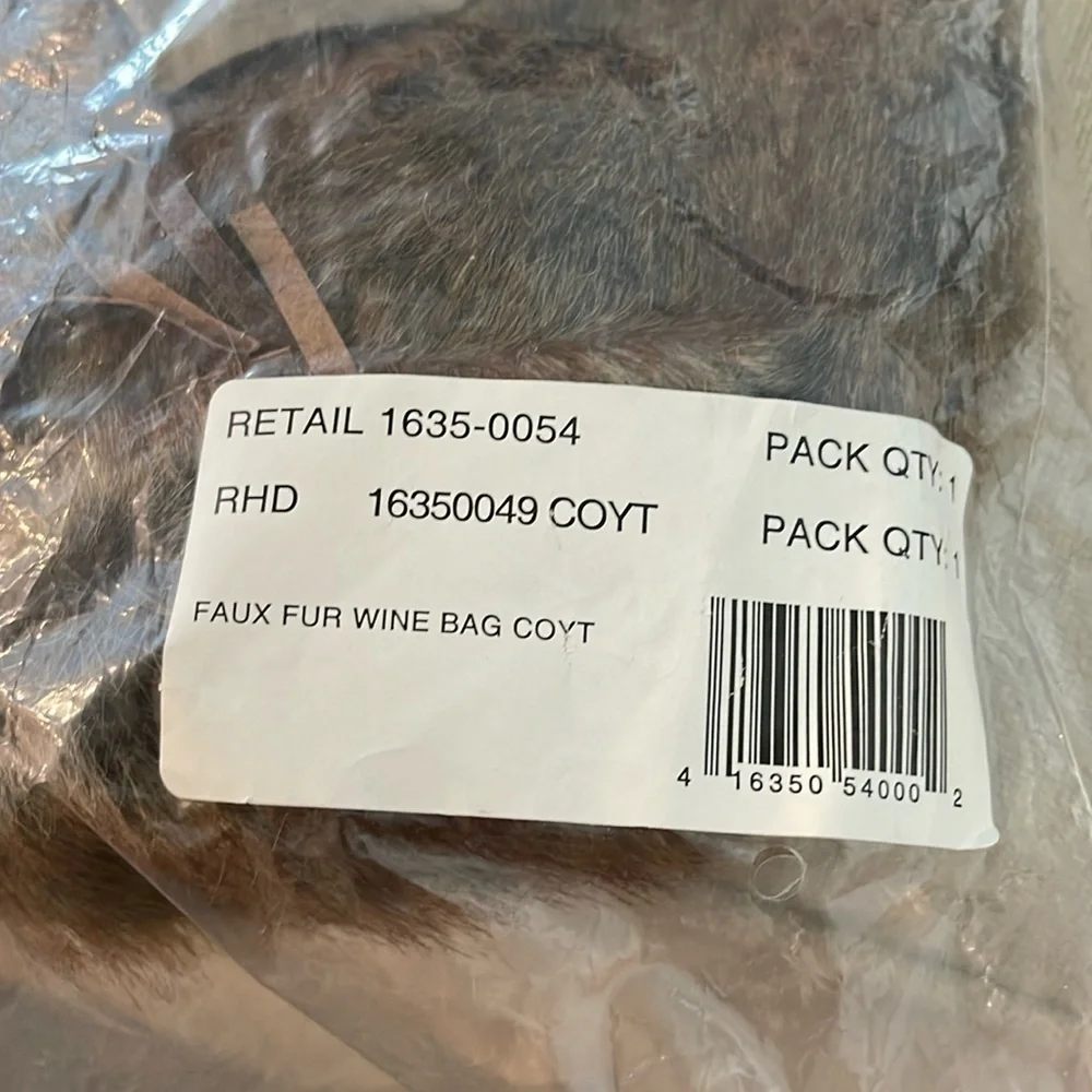 Pottery Barn faux fur wine bag in Coyote. Brand new and unused.